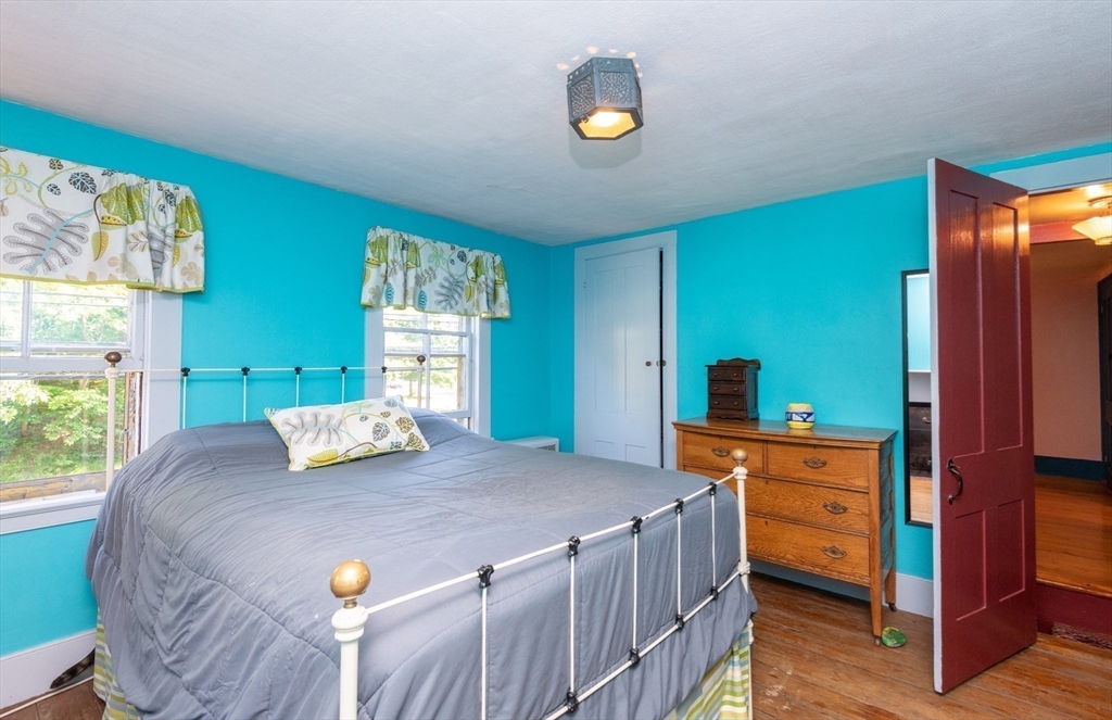 304 North Street Georgetown, MA 01833 - Photo 32 of 42 a bedroom with a bed and a dresser