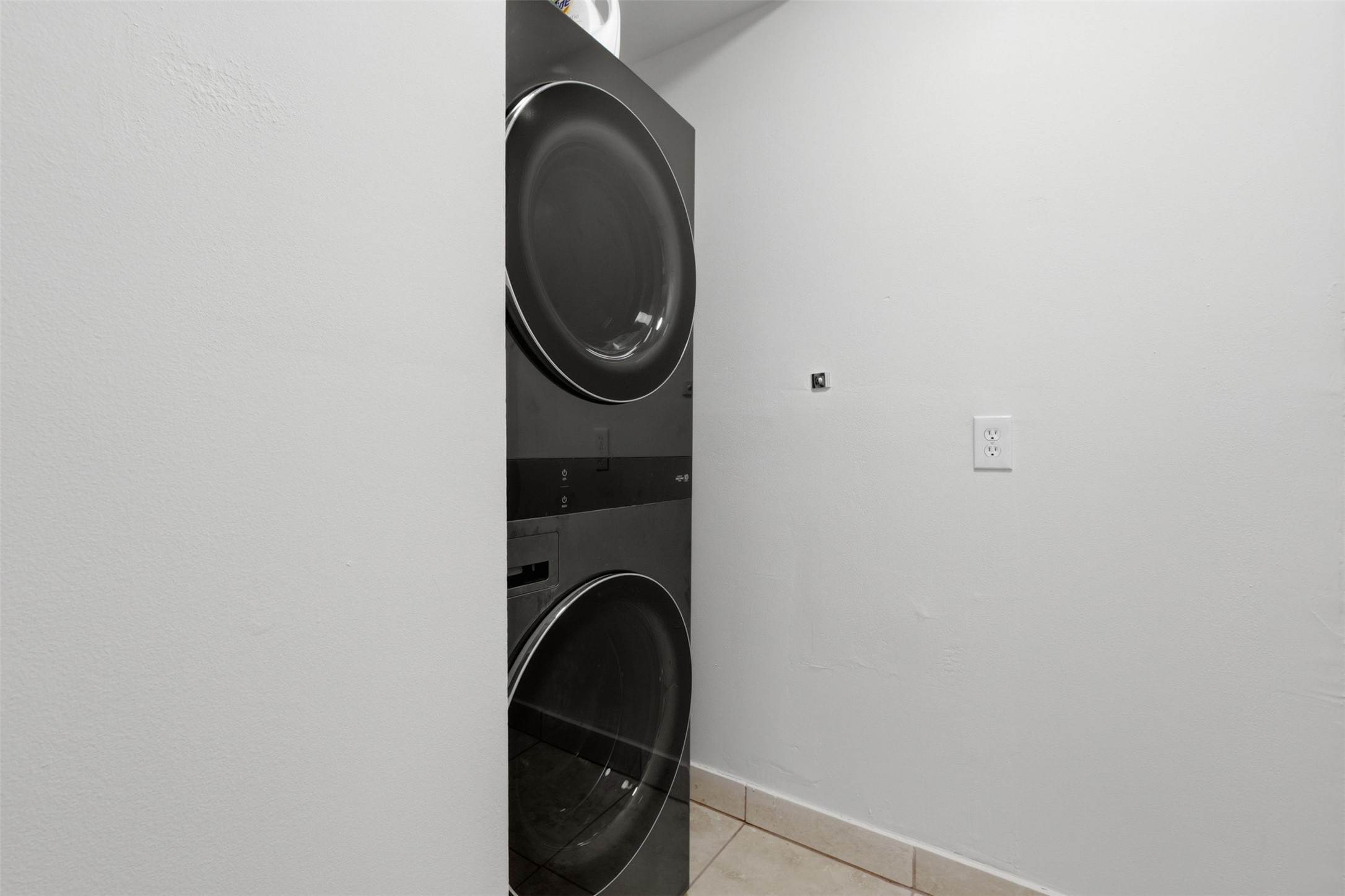 2132 Tangley Street Houston, TX 77005 - Photo 28 of 39 Laundry room with stacked washer and dryer included