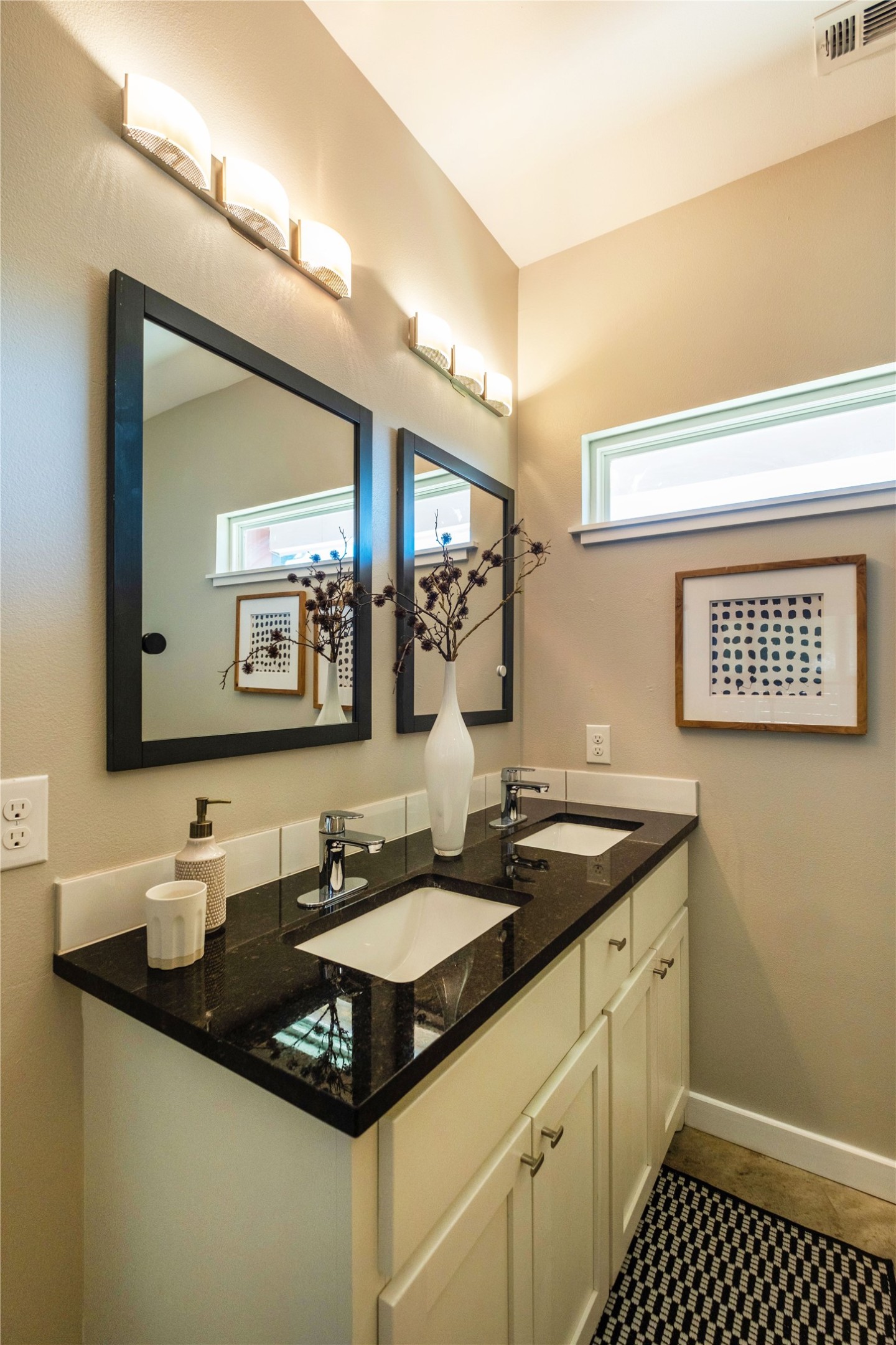 7601 Bethune Avenue, Unit B Austin, TX 78752 - Photo 13 of 39 a bathroom with a granite countertop sink a mirror and a