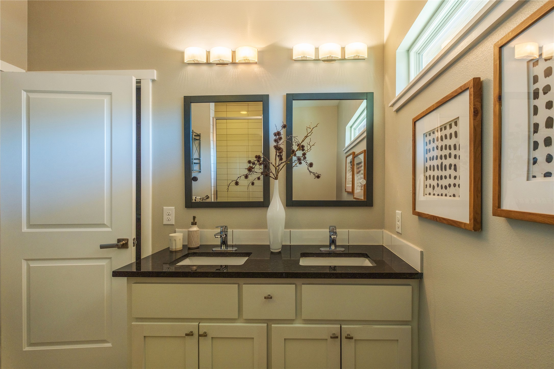 7601 Bethune Avenue, Unit B Austin, TX 78752 - Photo 14 of 39 a bathroom with double sink and two mirror