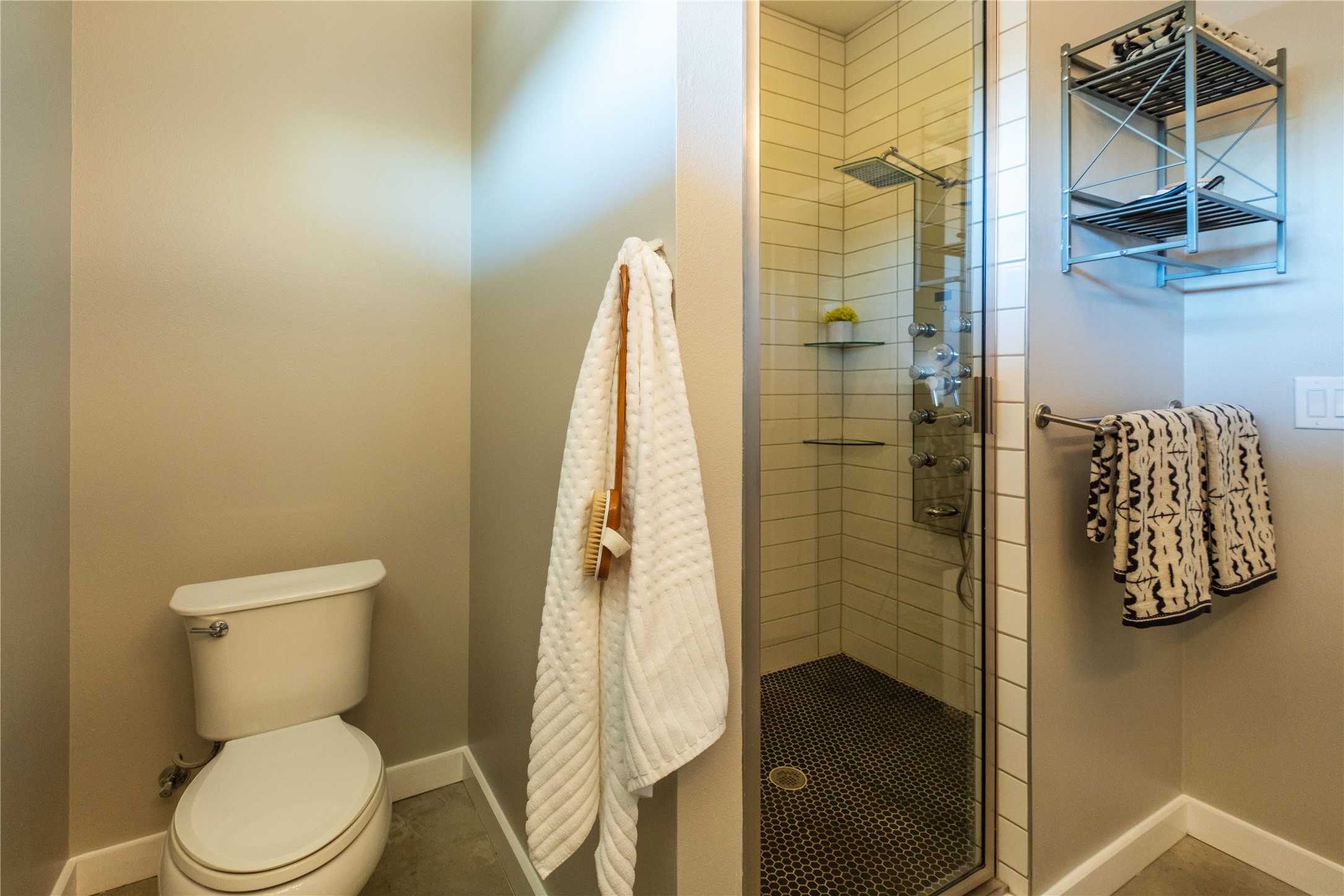 7601 Bethune Avenue, Unit B Austin, TX 78752 - Photo 15 of 39 a bathroom with a toilet and shower