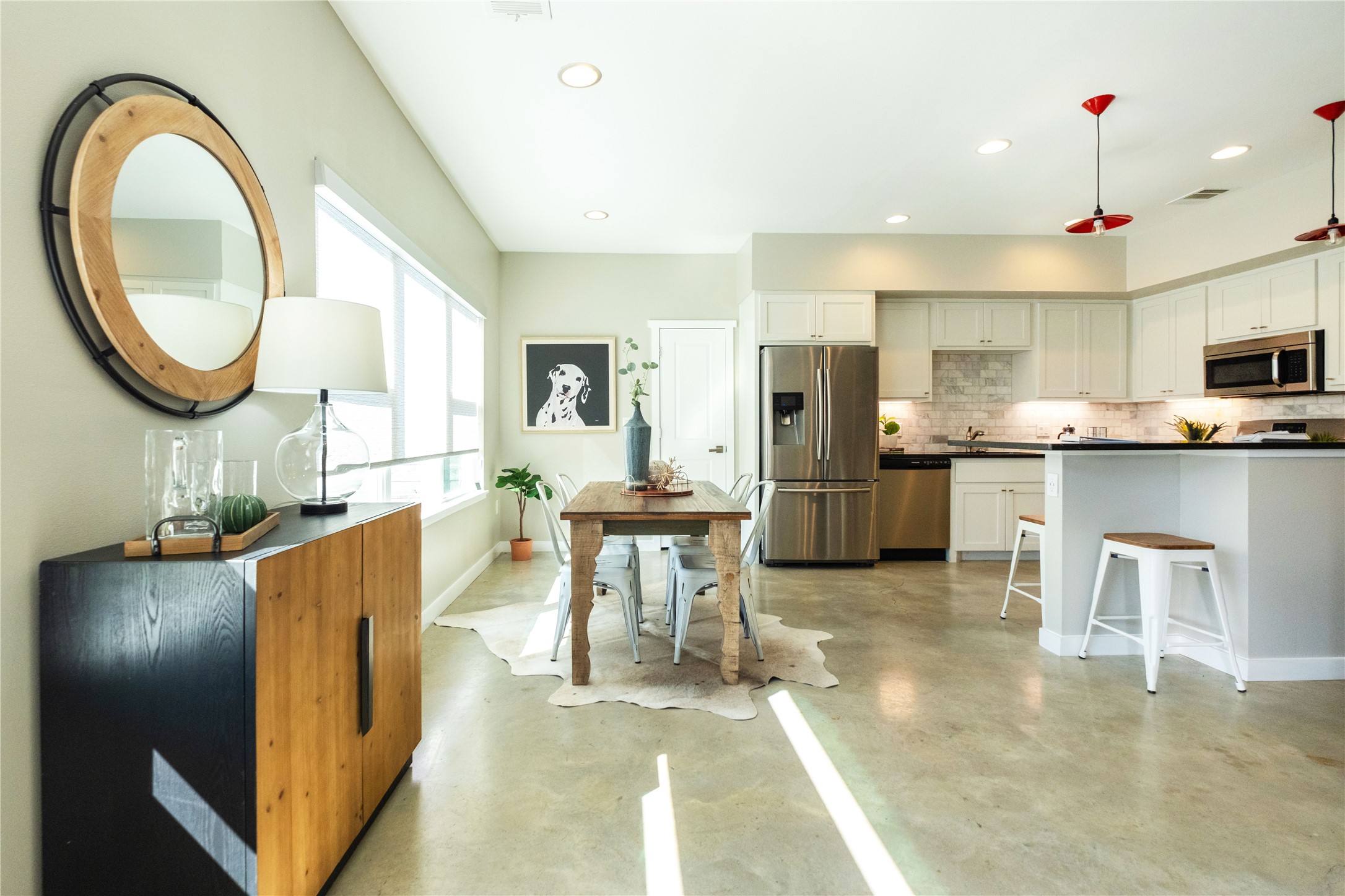 7601 Bethune Avenue, Unit B Austin, TX 78752 - Photo 2 of 39 a living room with stainless steel appliances kitchen island granite countertop a table and chairs in it