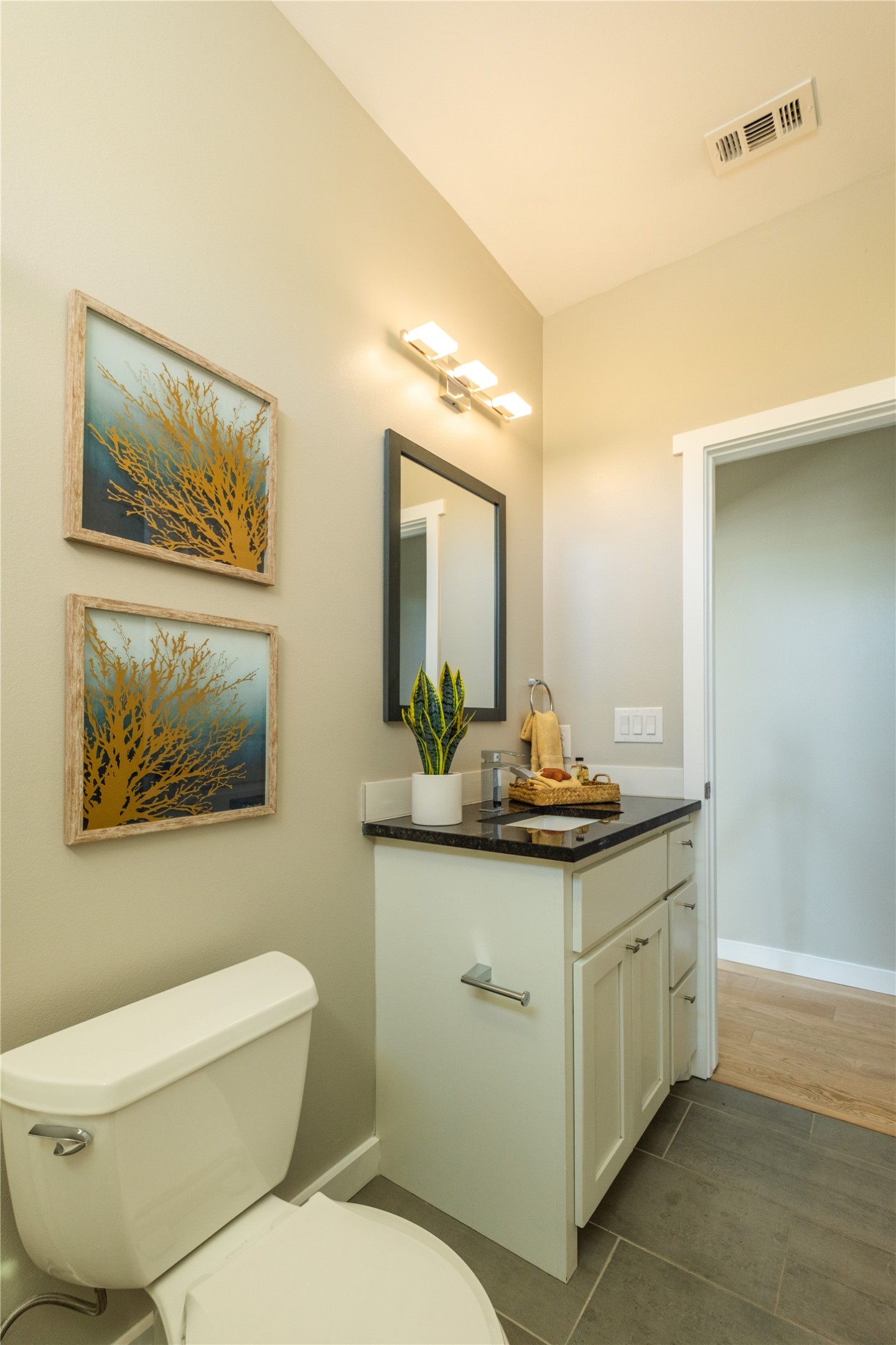 7601 Bethune Avenue, Unit B Austin, TX 78752 - Photo 25 of 39 a bathroom with a toilet sink and mirror