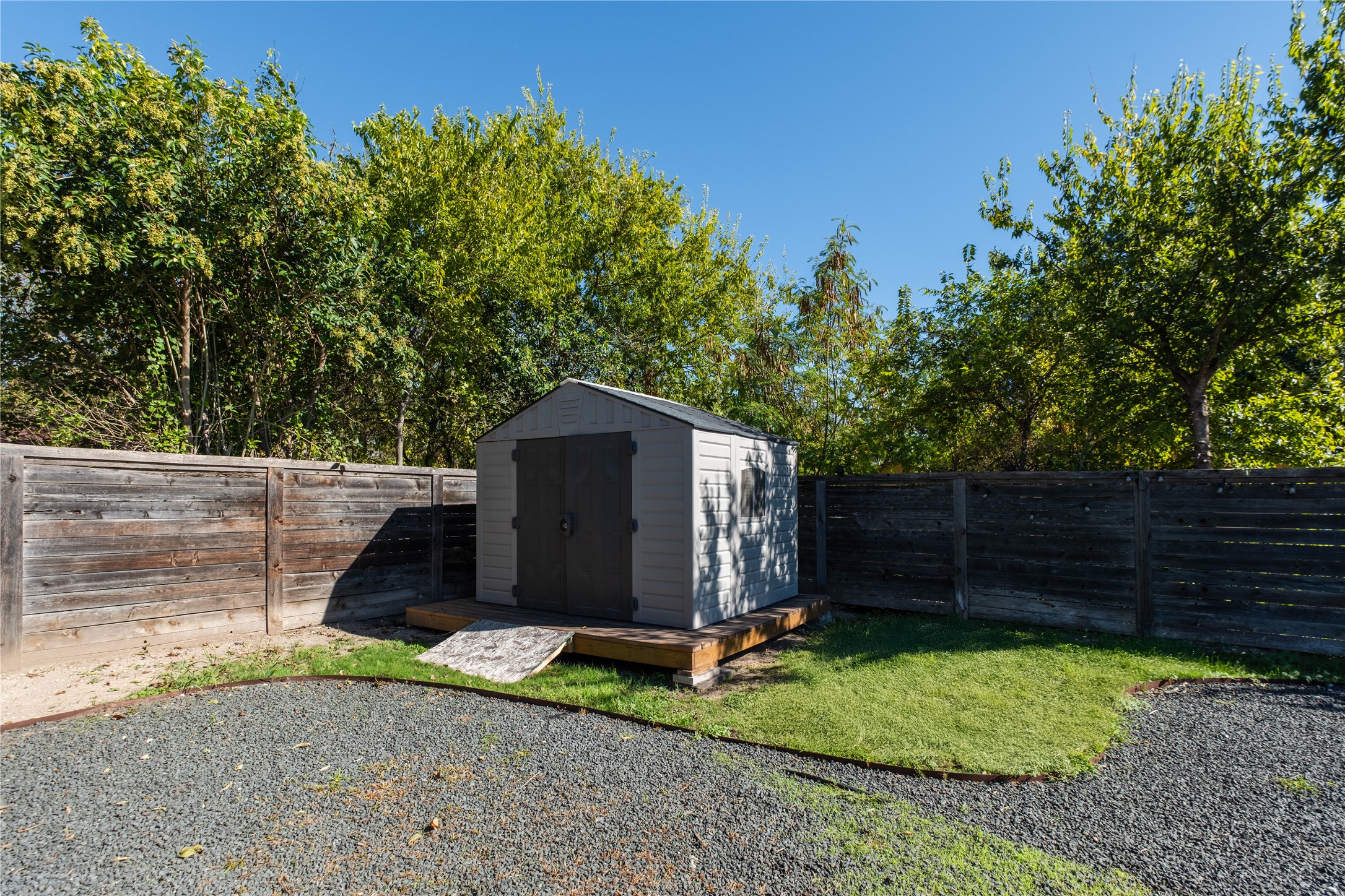 7601 Bethune Avenue, Unit B Austin, TX 78752 - Photo 36 of 39 a view of backyard with potted plants and a wooden fence