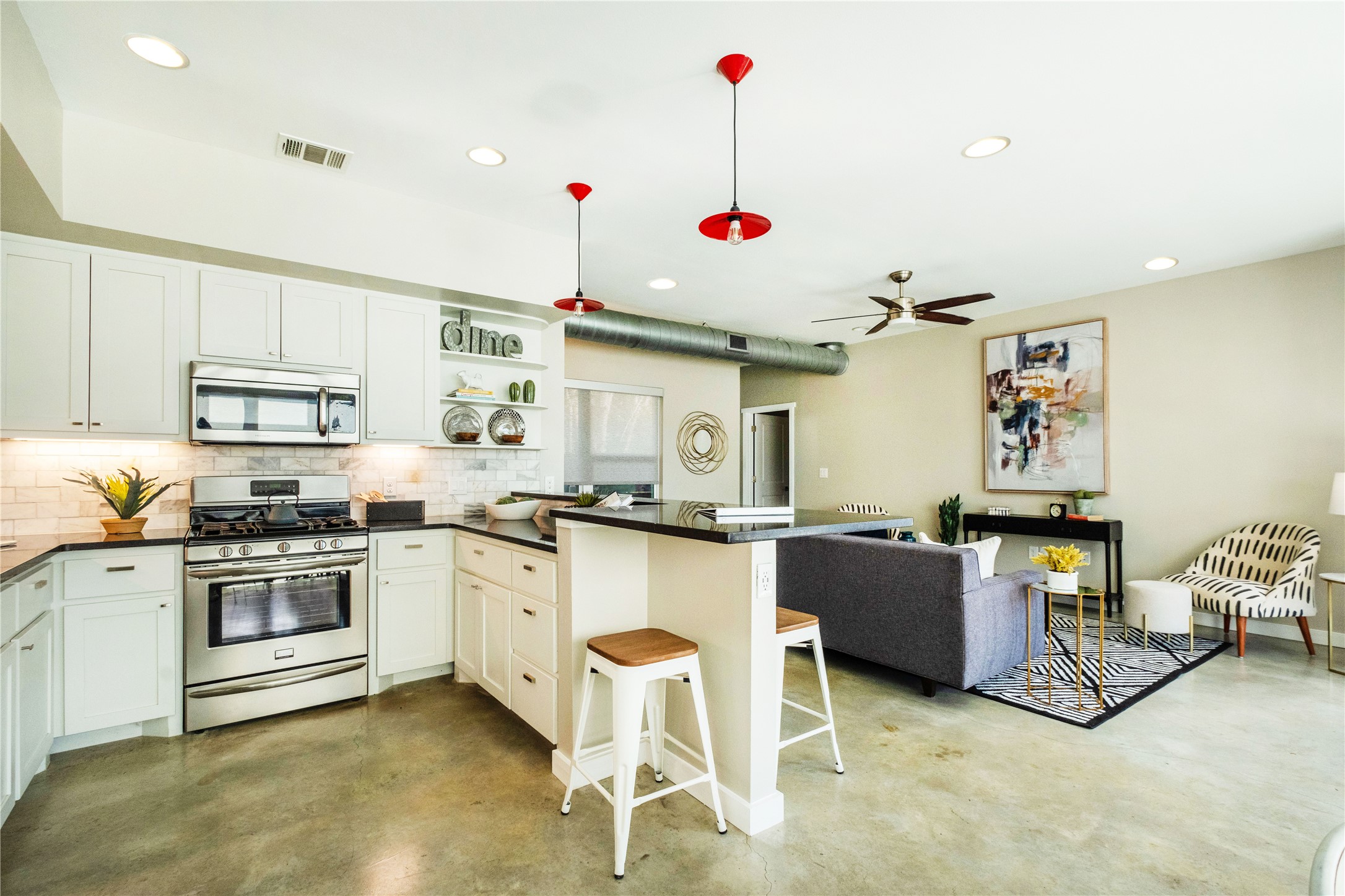 7601 Bethune Avenue, Unit B Austin, TX 78752 - Photo 4 of 39 a kitchen with granite countertop counter top space cabinets stainless steel appliances and a window