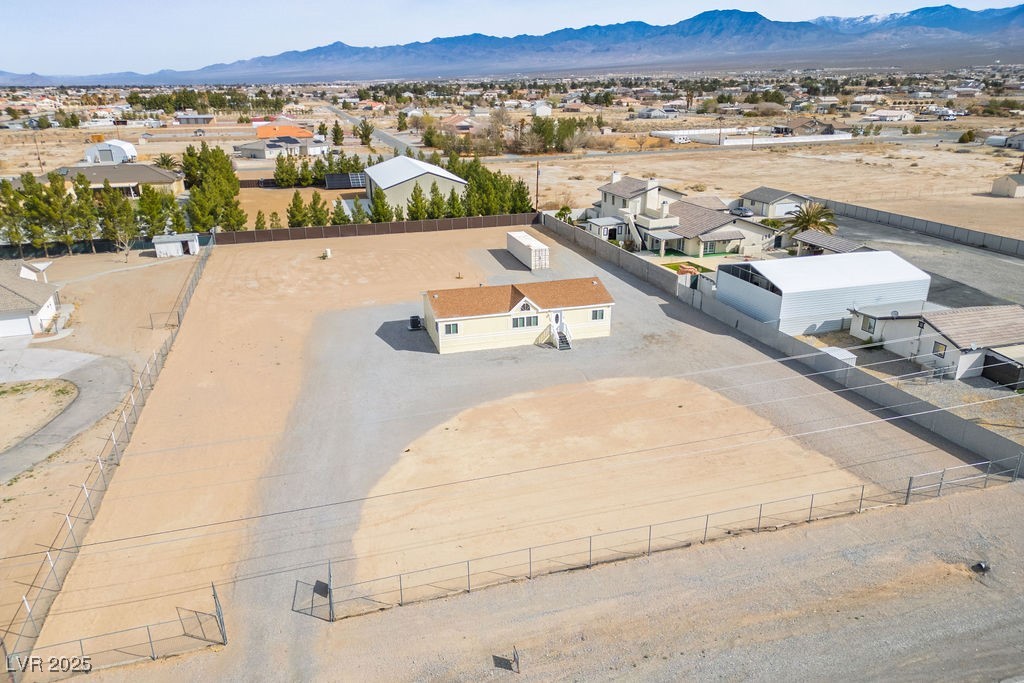 Drone / aerial view with a residential view and a mountain view