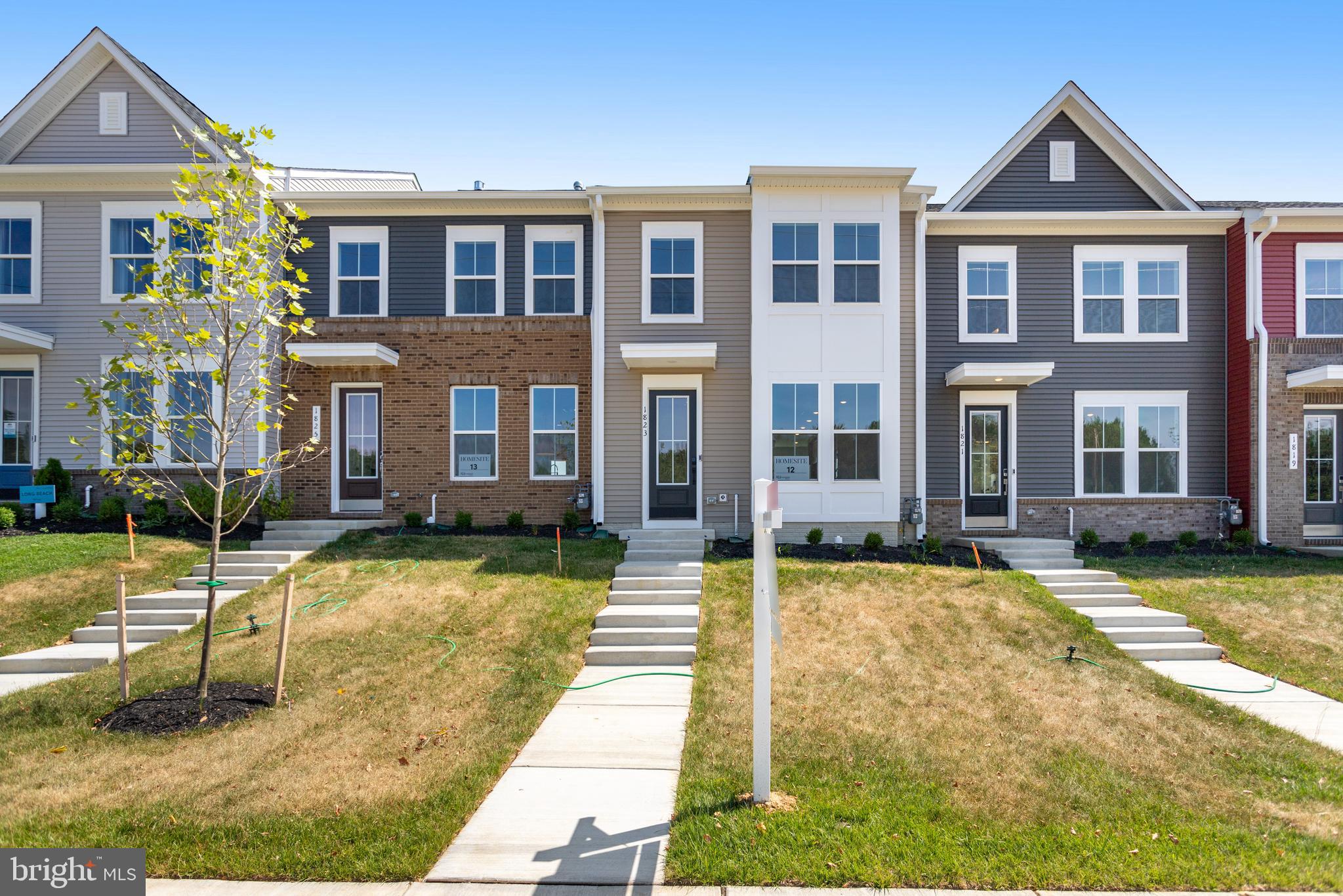 751 Elevation Road Frederick, MD 21702 - Photo 2 of 35 a view of a brick building next to a yard