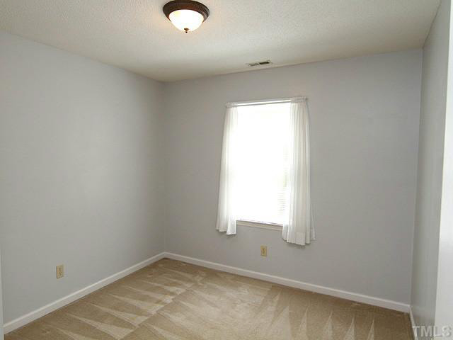 5304 Middleton Road Durham, NC 27713 - Photo 11 of 16 an empty room with a window