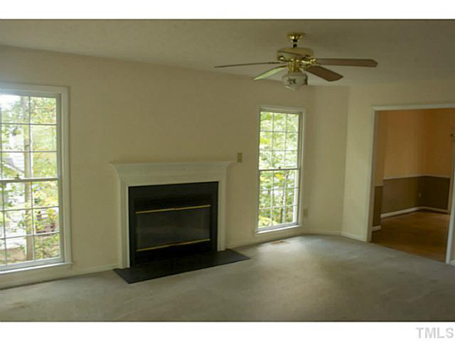 5304 Middleton Road Durham, NC 27713 - Photo 5 of 16 a living room with furniture and a fireplace