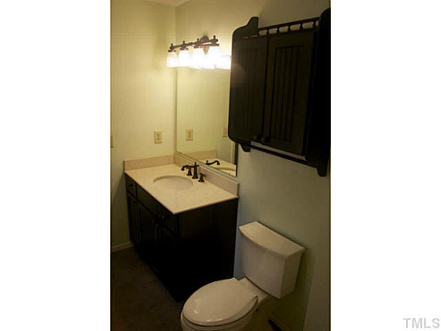 5304 Middleton Road Durham, NC 27713 - Photo 10 of 16 a bathroom with a sink vanity and toilet