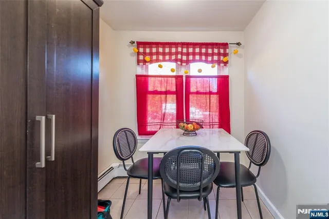 a view of a dining room with furniture and window