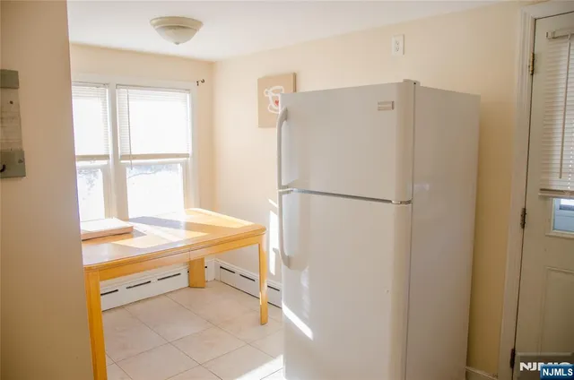 a room with a table and chairs