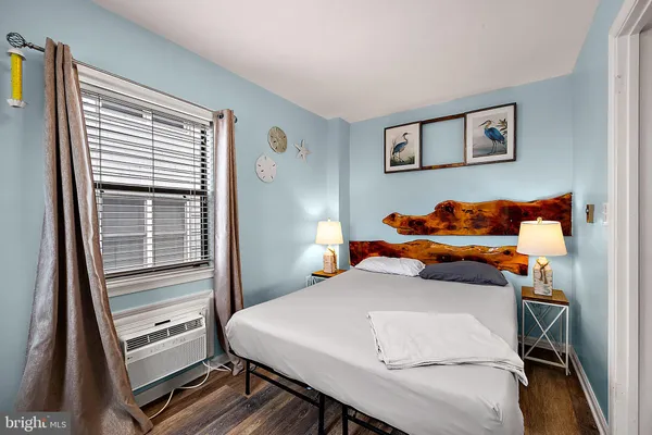 a bed room with a bed furniture and a window