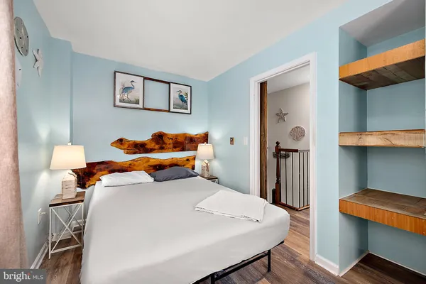 a bed room with a bed and a chair