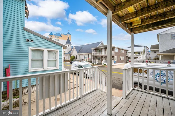 a view of a balcony with wooden floor