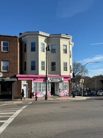 a view of a building with a street