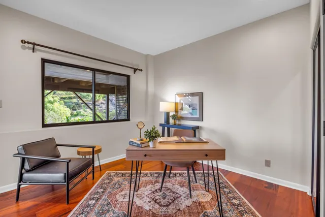 a workspace with furniture and a window