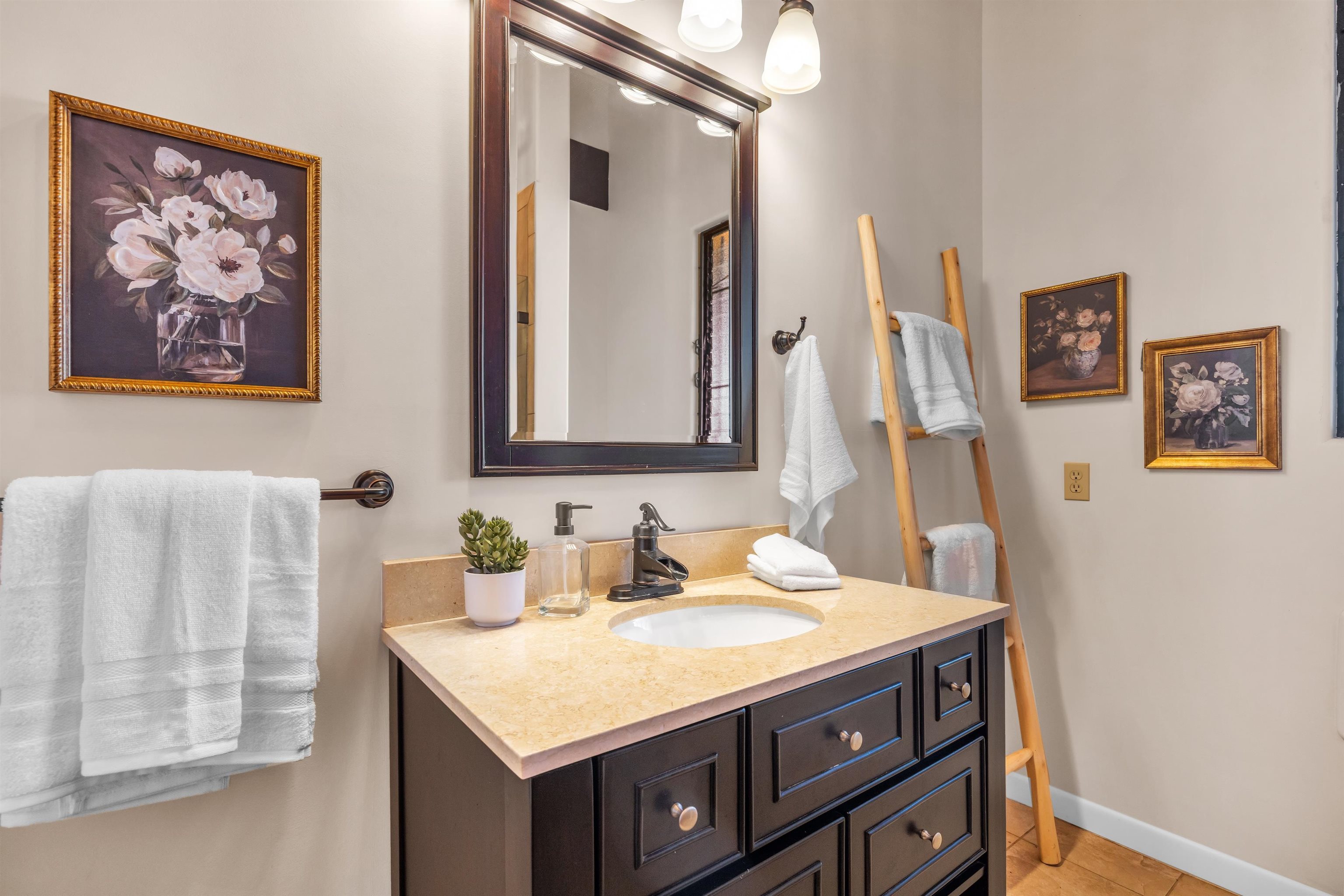 110 Kamehameiki Road Kula, HI 96790 - Photo 20 of 50 a bathroom with a sink vanity and a mirror