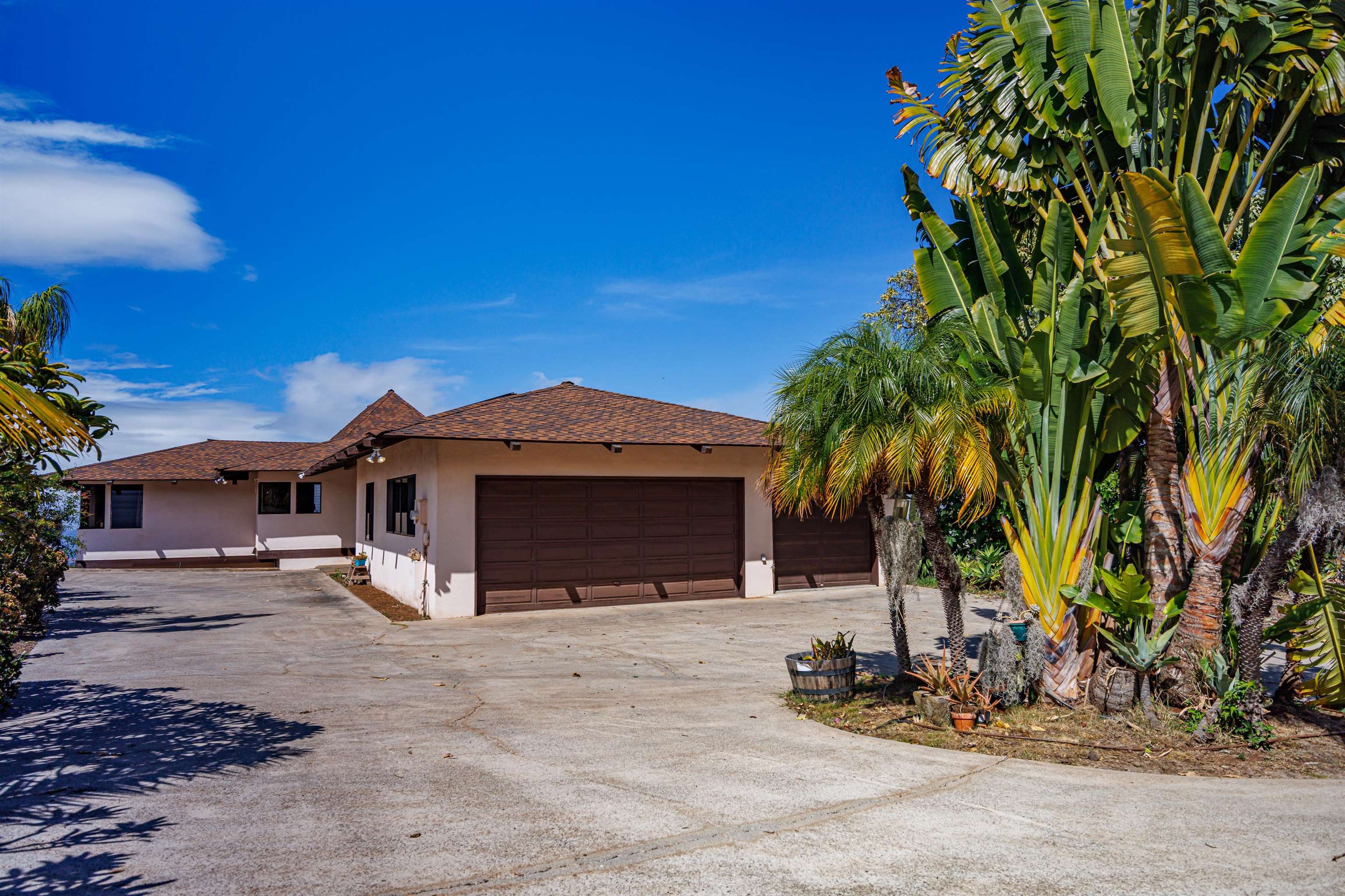 110 Kamehameiki Road Kula, HI 96790 - Photo 26 of 50 a front view of a house with a yard