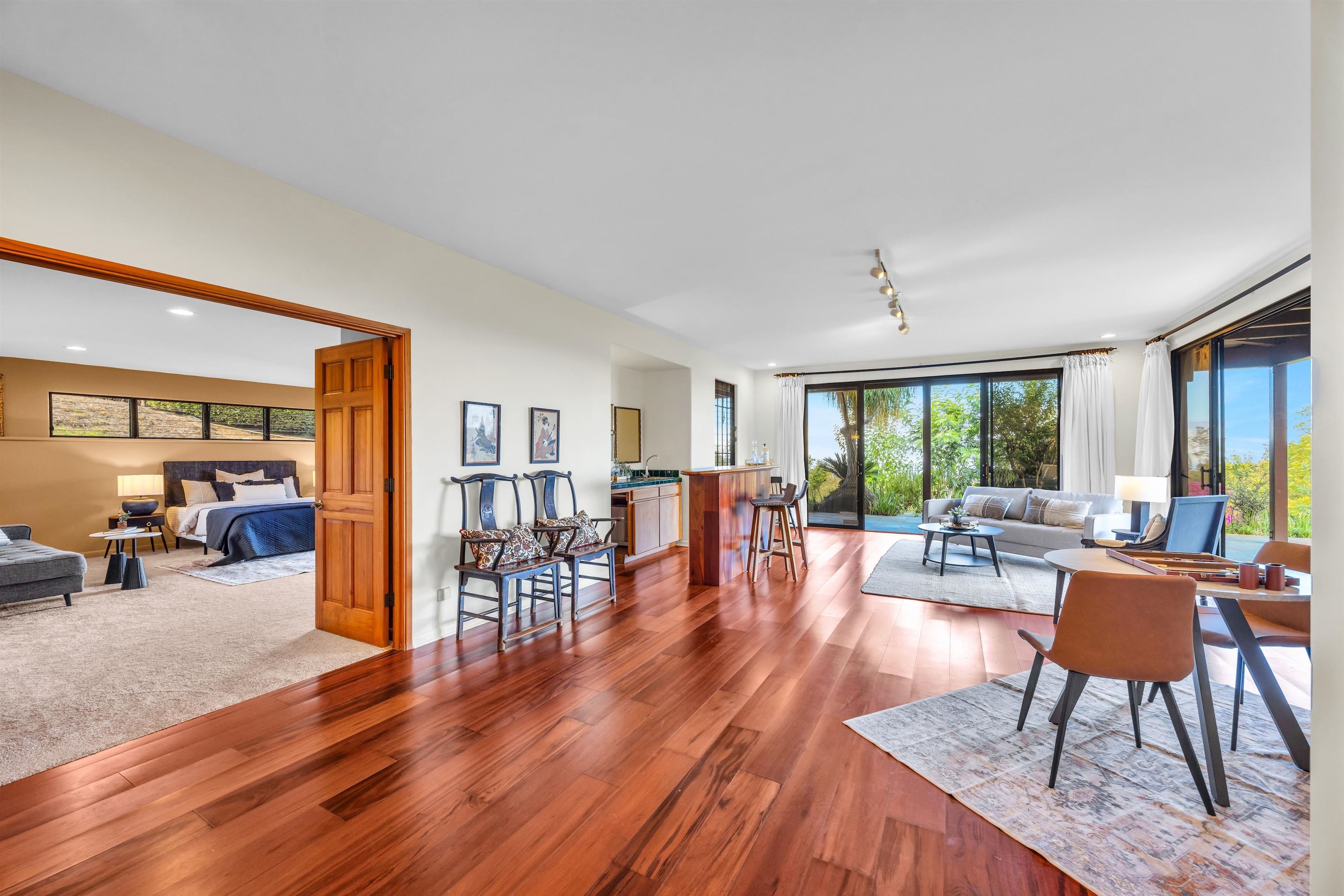 110 Kamehameiki Road Kula, HI 96790 - Photo 29 of 50 a living room with furniture a large window and wooden floor
