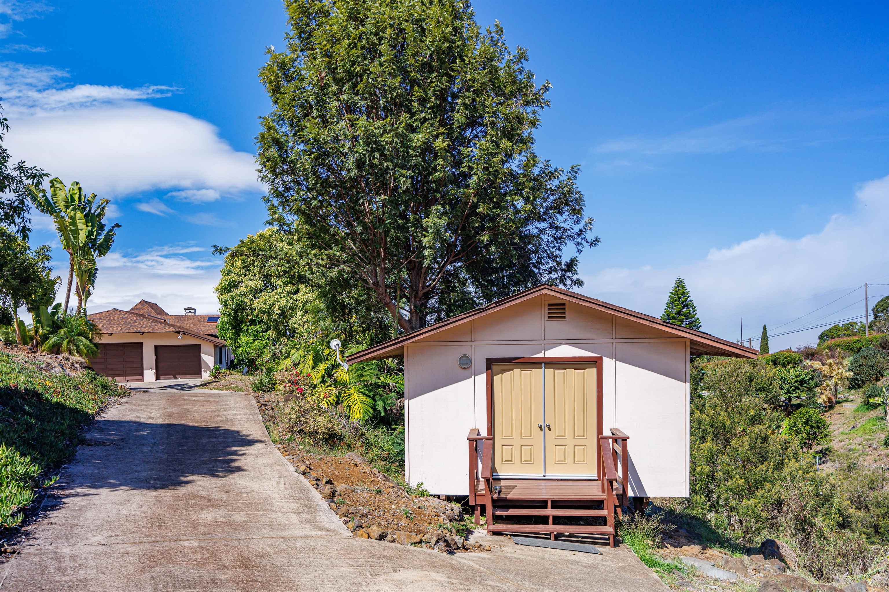 110 Kamehameiki Road Kula, HI 96790 - Photo 29 of 50 a front view of a house with a yard