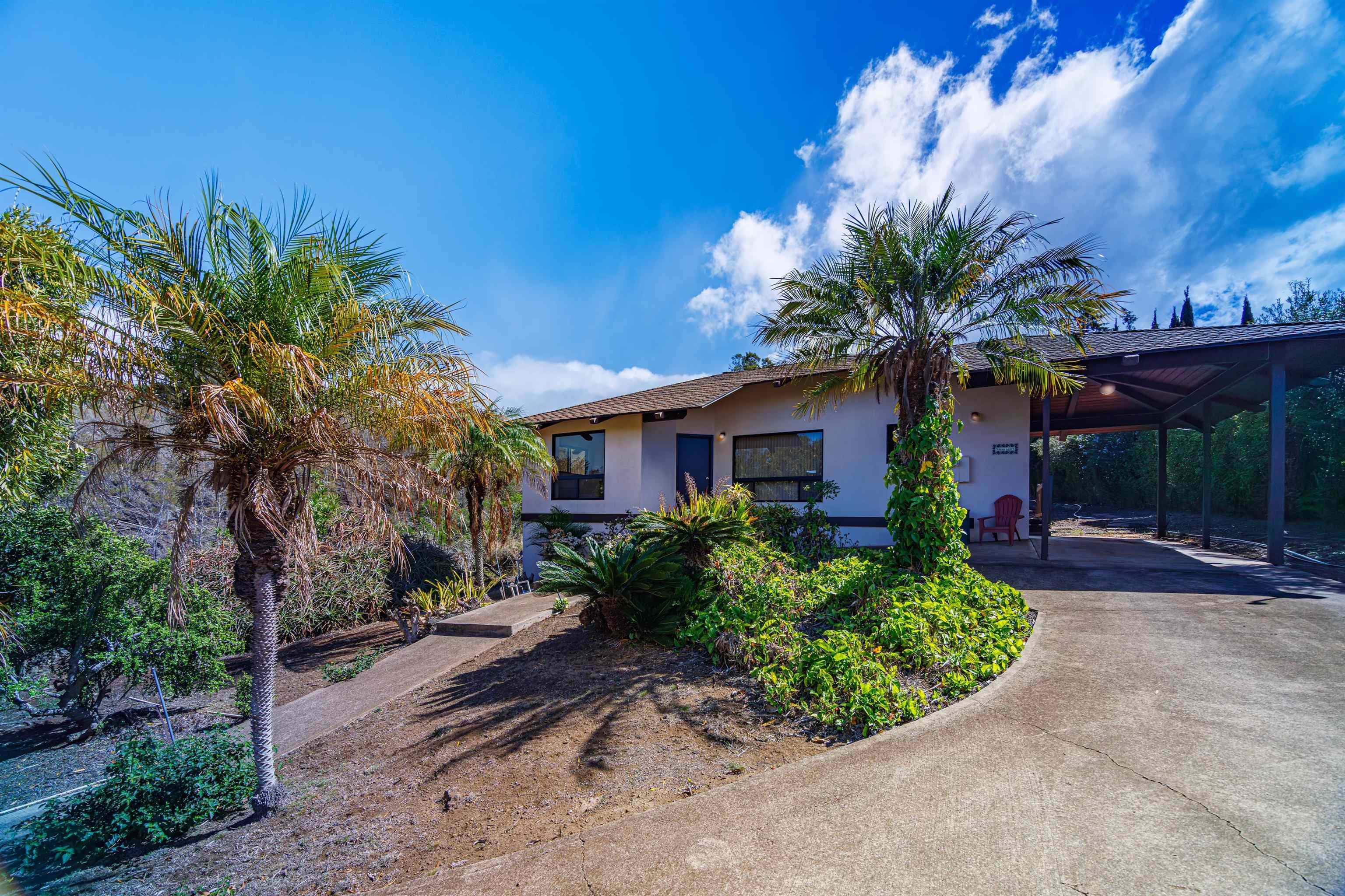 110 Kamehameiki Road Kula, HI 96790 - Photo 30 of 50 a front view of a house with a yard