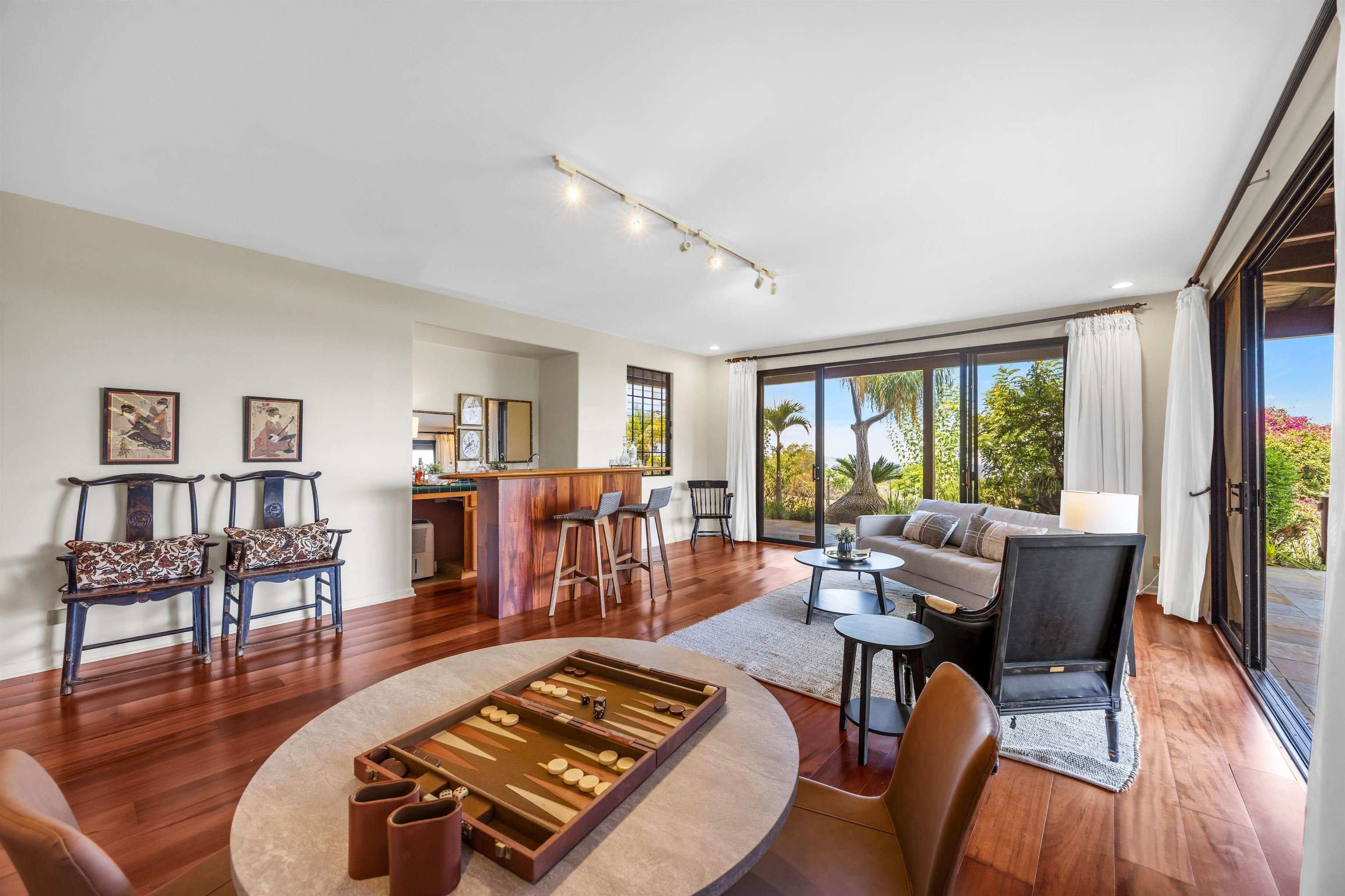 110 Kamehameiki Road Kula, HI 96790 - Photo 30 of 50 a living room with furniture and a wooden floor