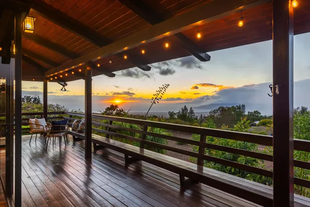 a view of a balcony with chairs