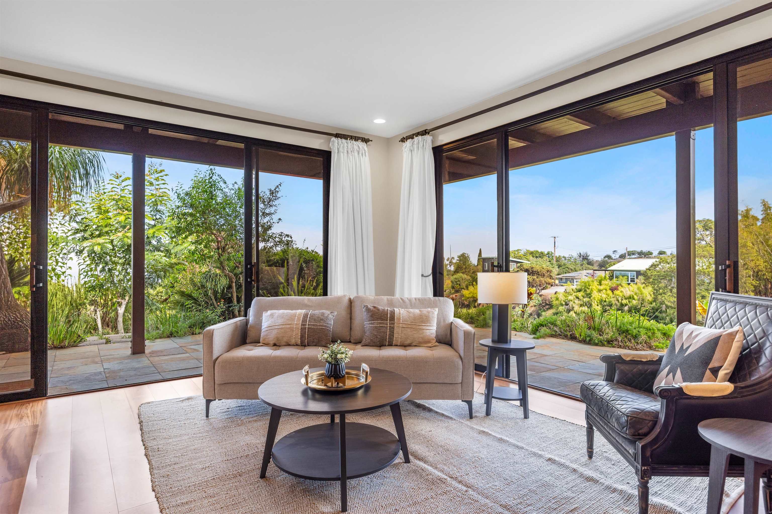 110 Kamehameiki Road Kula, HI 96790 - Photo 39 of 50 a living room with furniture and a large window