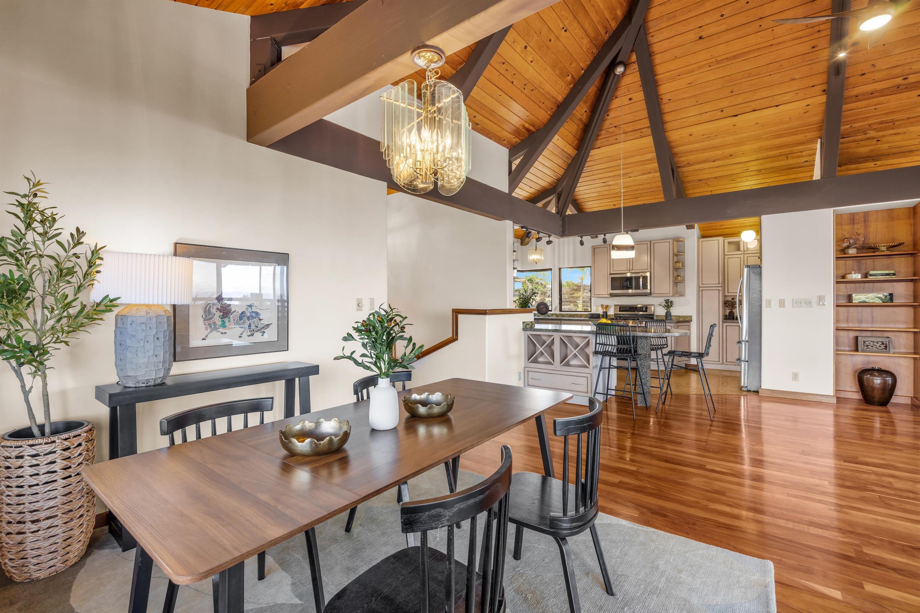 110 Kamehameiki Road Kula, HI 96790 - Photo 47 of 50 a dining room with furniture and wooden floor