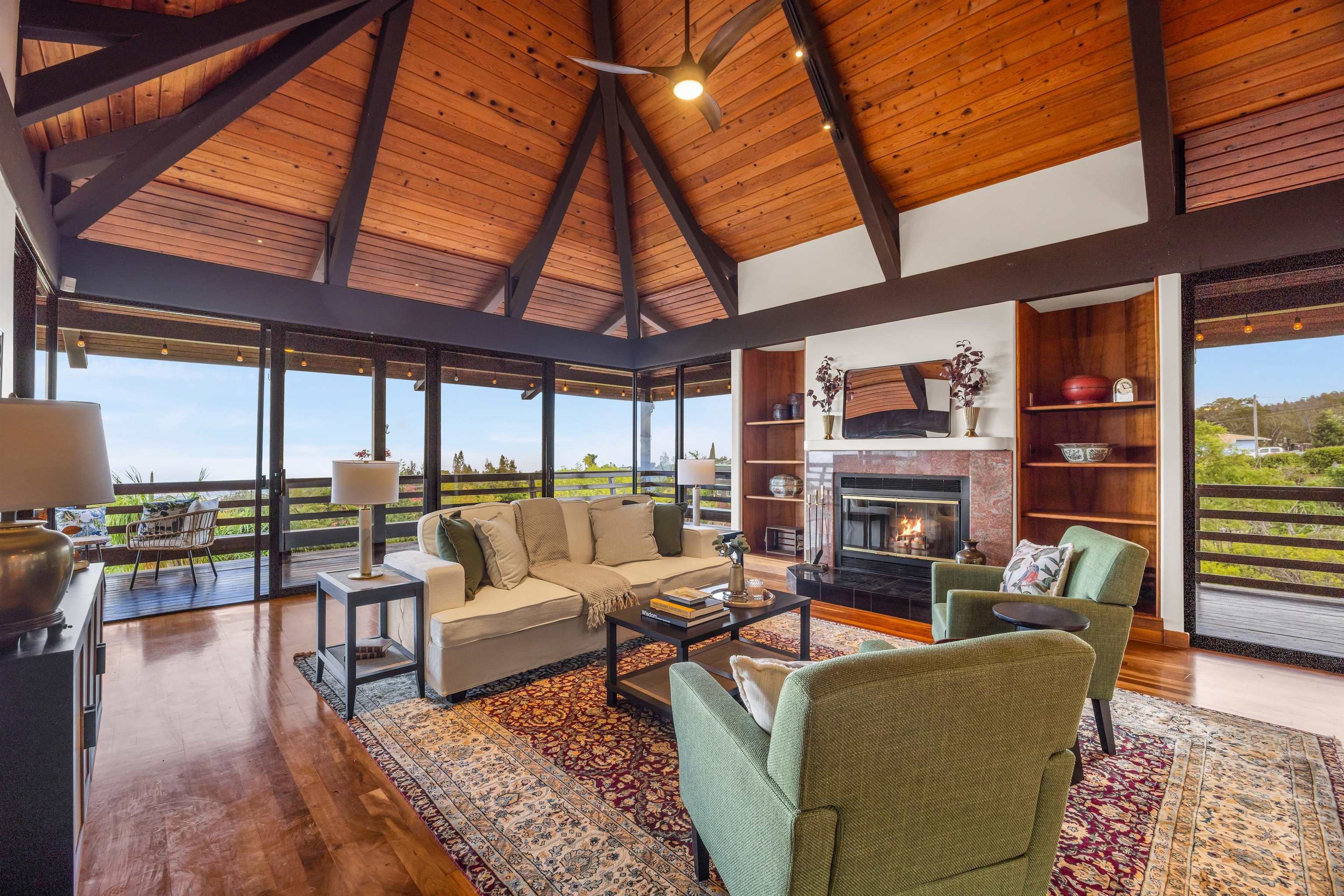 110 Kamehameiki Road Kula, HI 96790 - Photo 49 of 50 a living room with furniture and a floor to ceiling window