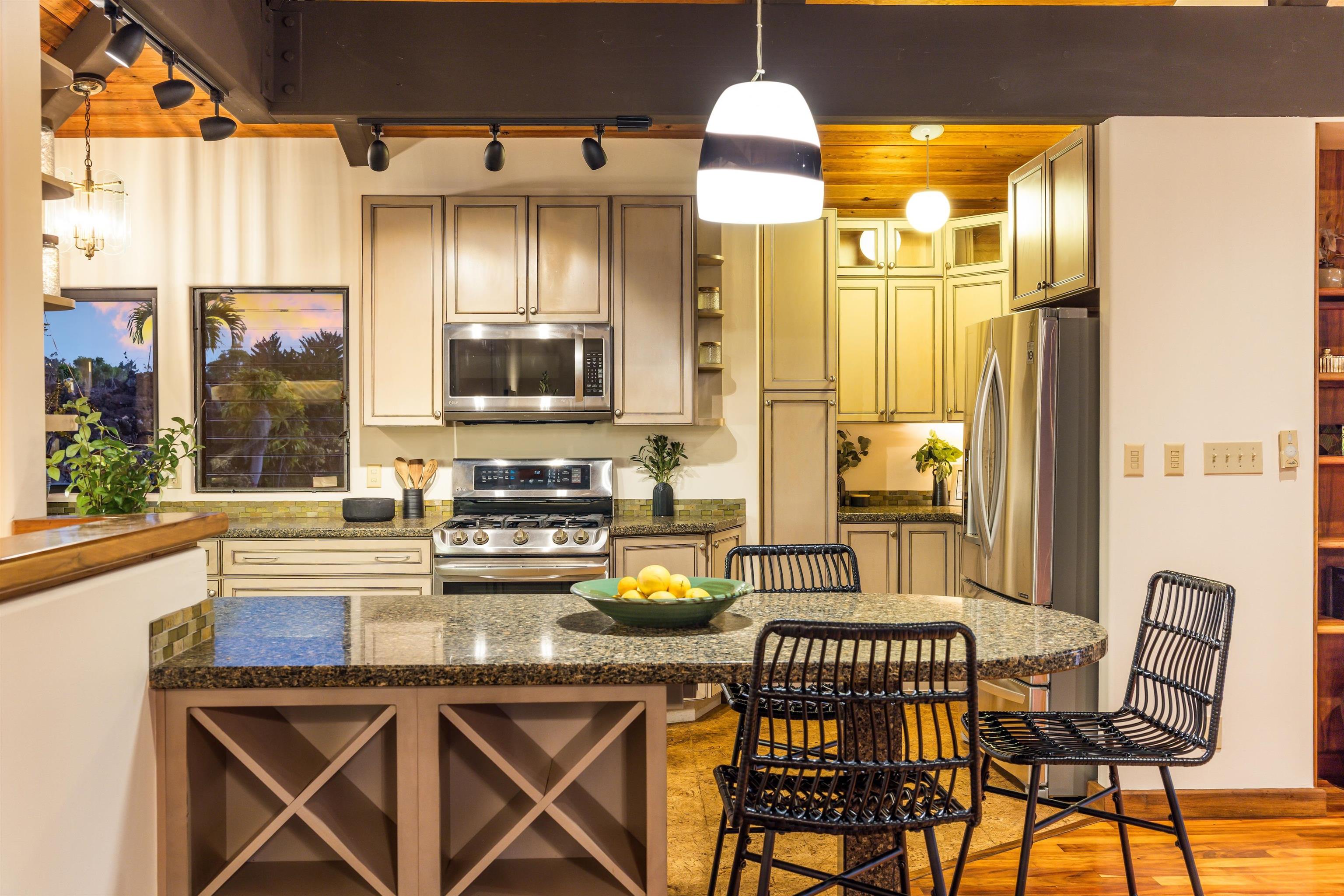 110 Kamehameiki Road Kula, HI 96790 - Photo 6 of 50 a kitchen with a sink cabinets and window
