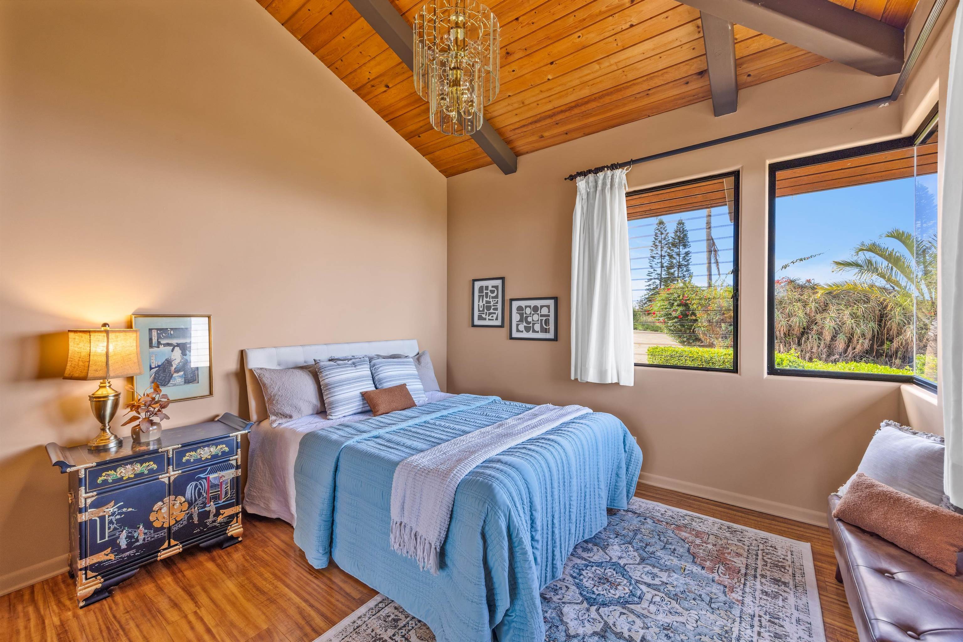 110 Kamehameiki Road Kula, HI 96790 - Photo 9 of 50 a bedroom with a bed and wooden floor