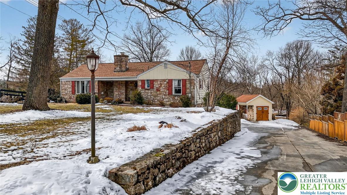 3535 Altonah Road Bethlehem, PA 18017 - Photo 2 of 49 a front view of a house with a yard covered in snow