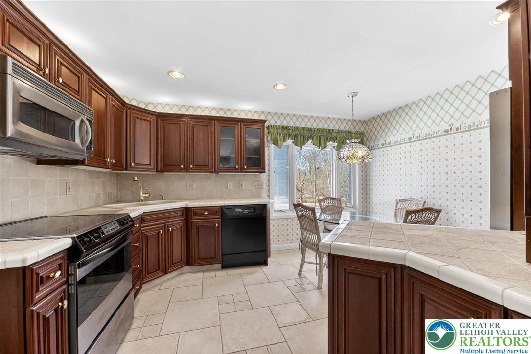 3535 Altonah Road Bethlehem, PA 18017 - Photo 24 of 49 a kitchen with a sink stove and microwave