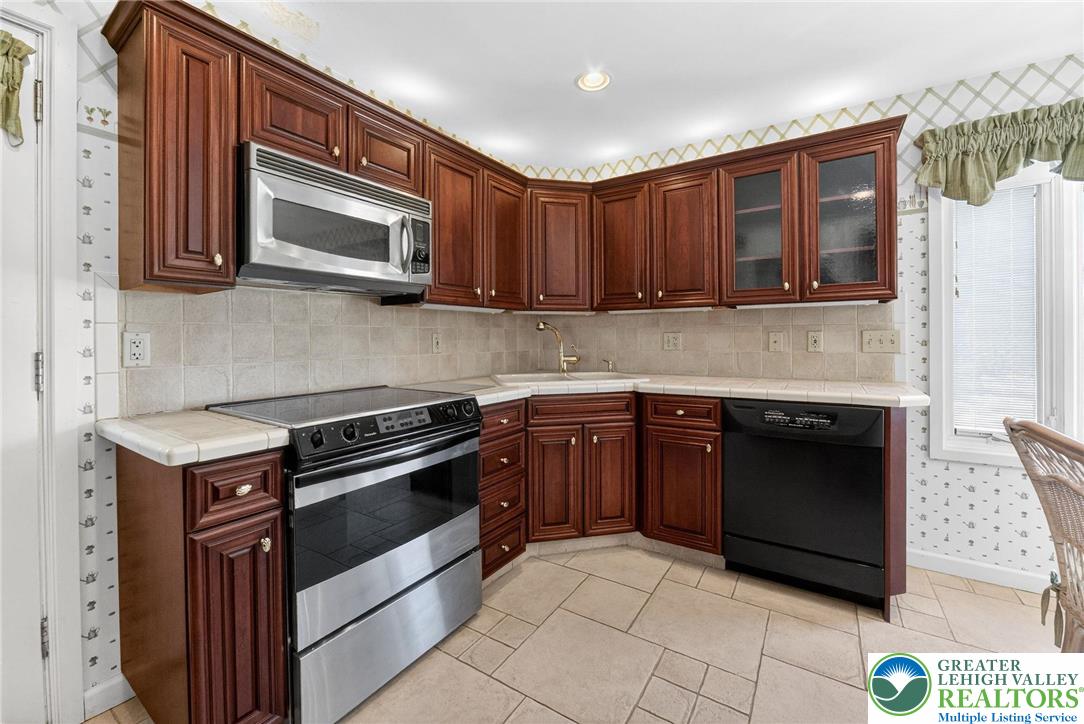 3535 Altonah Road Bethlehem, PA 18017 - Photo 25 of 49 a kitchen with stainless steel appliances granite countertop a stove top oven and granite counter tops