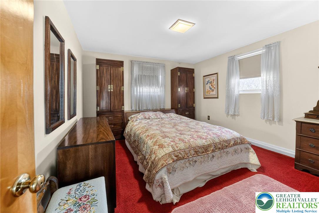 3535 Altonah Road Bethlehem, PA 18017 - Photo 32 of 49 a bedroom with a bed and a flat screen tv