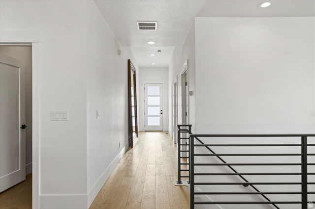 3349 Oxford Loop Morgan, UT 84050 - Photo 21 of 47 Hallway with light wood-type flooring and recessed lighting