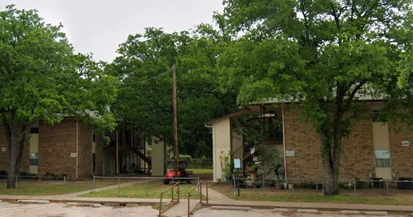 an outdoor space with lots of trees
