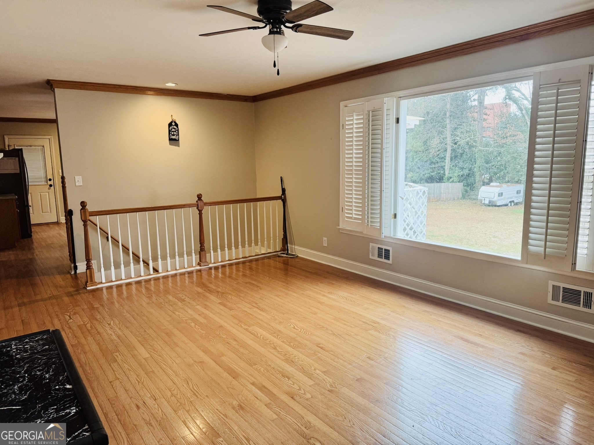 110 Pine Street Barnesville, GA 30204 - Photo 13 of 31 a view of livingroom with hardwood floor and a ceiling fan