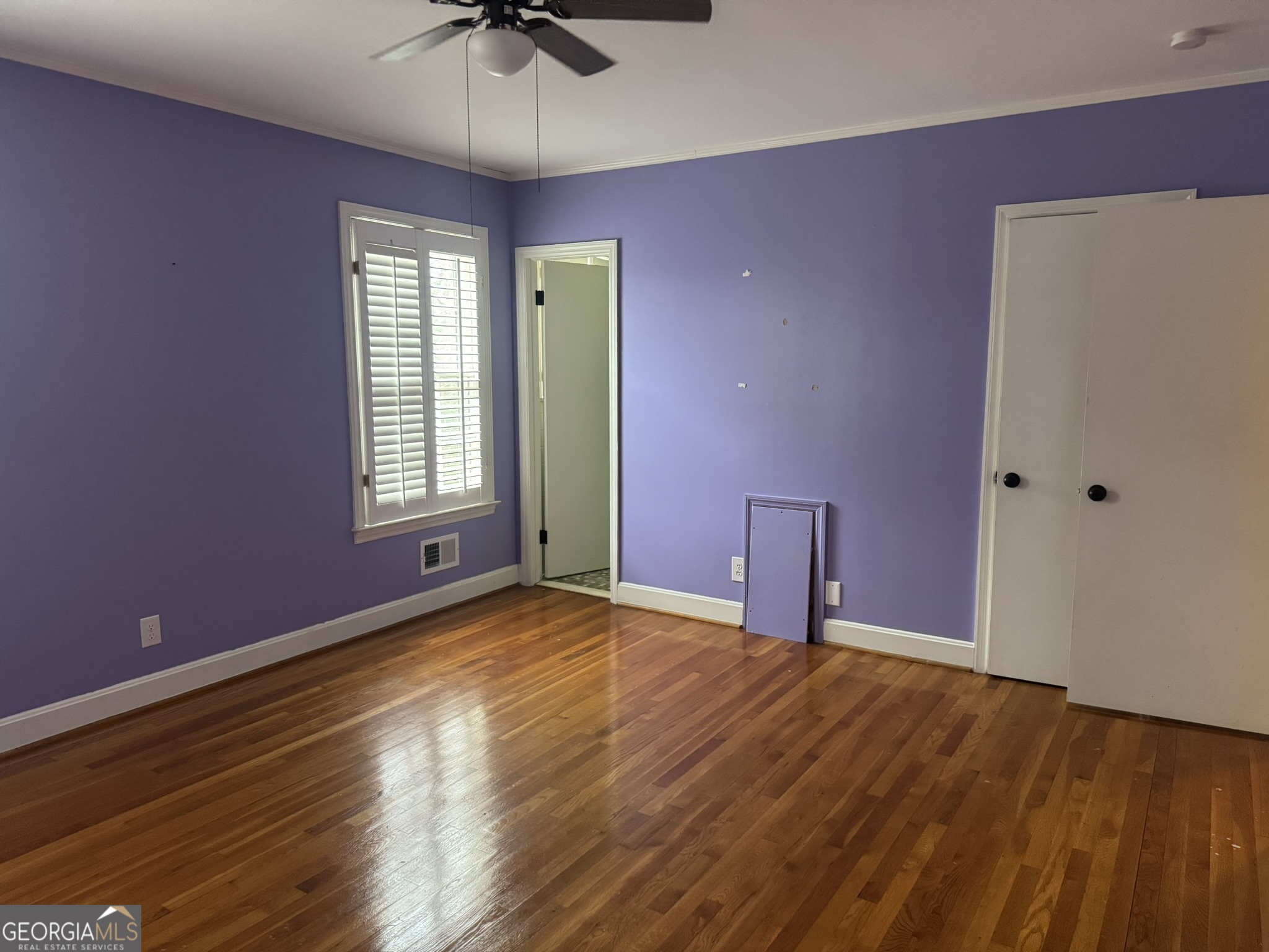110 Pine Street Barnesville, GA 30204 - Photo 16 of 31 a view of an empty room with a window and a kitchen