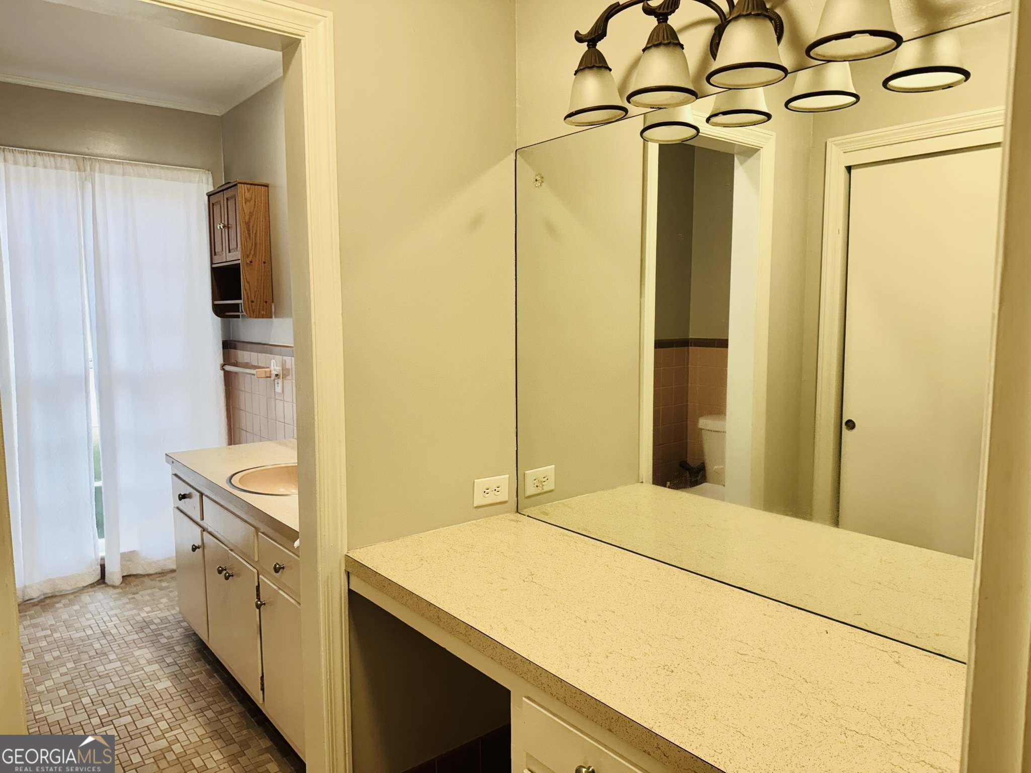 110 Pine Street Barnesville, GA 30204 - Photo 19 of 31 a bathroom with a granite countertop sink and a mirror