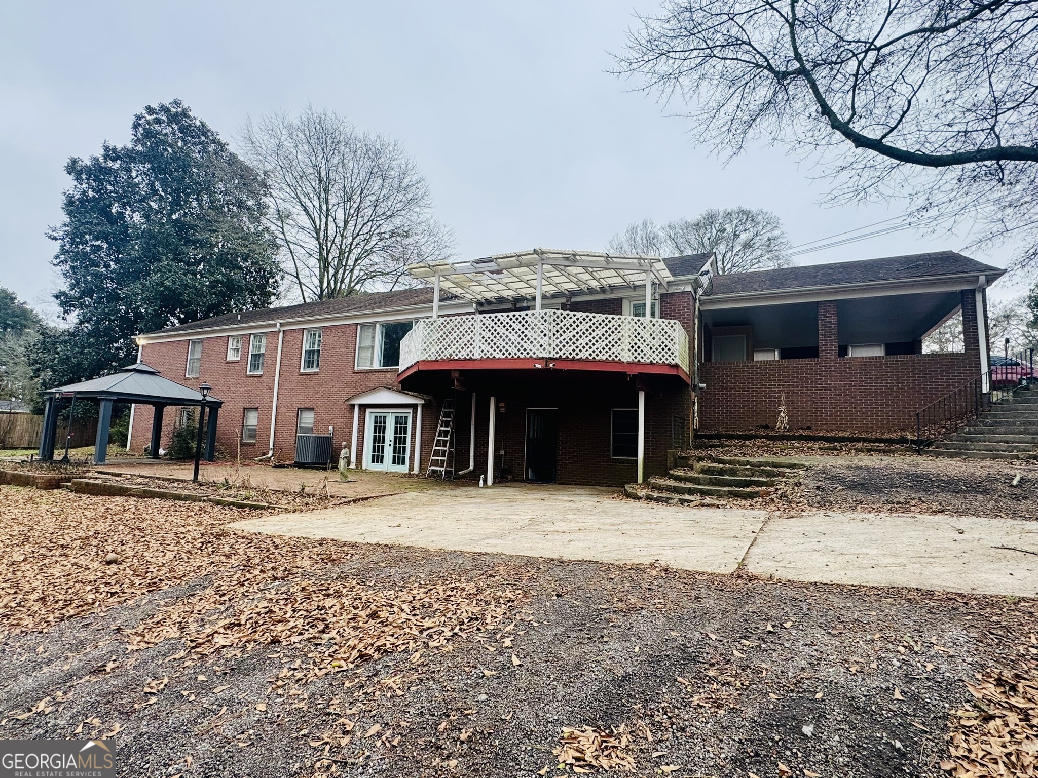 110 Pine Street Barnesville, GA 30204 - Photo 2 of 31 a front view of a house with a yard covered with snow in front of house