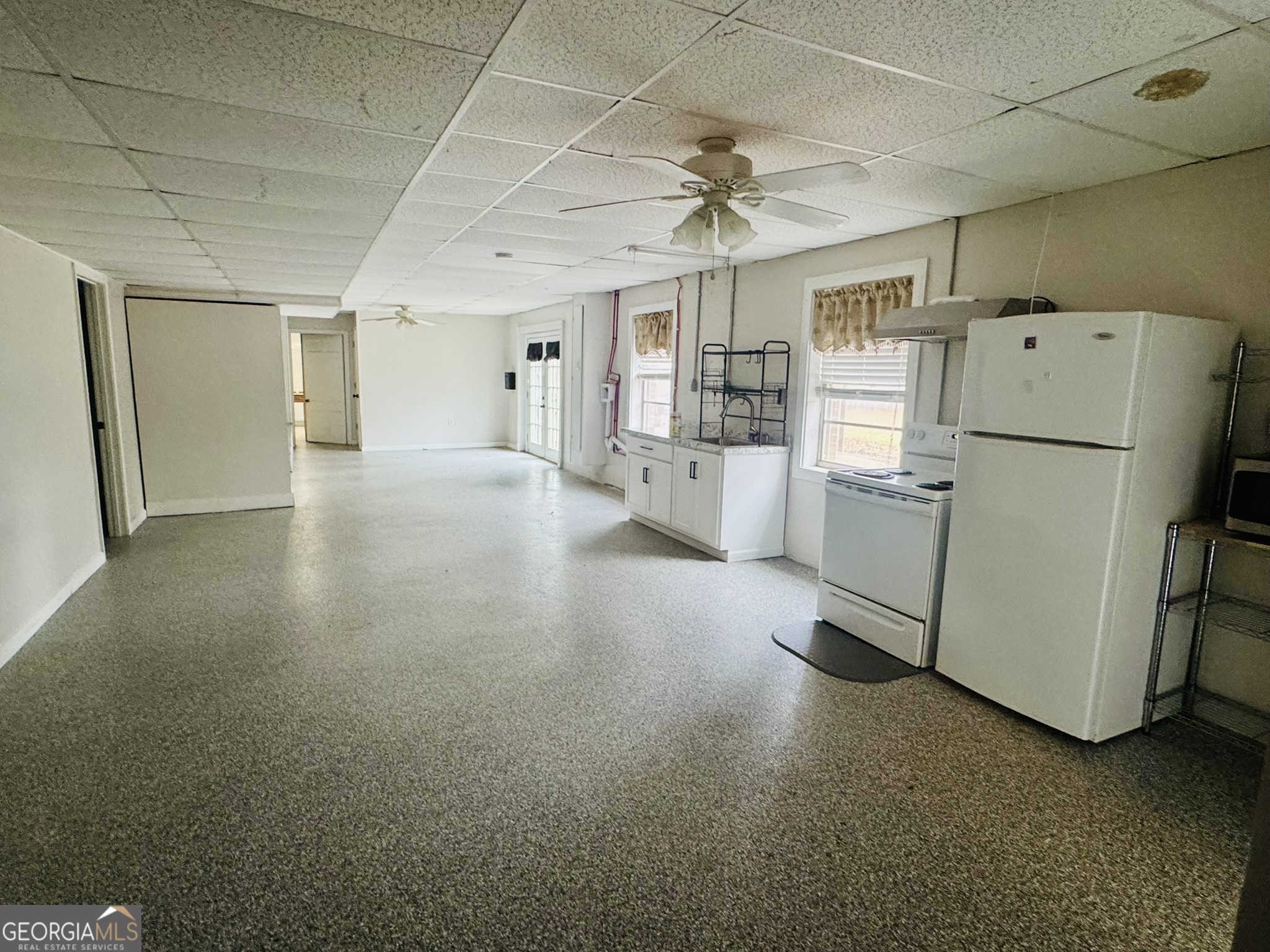 110 Pine Street Barnesville, GA 30204 - Photo 26 of 31 a view of a kitchen with refrigerator and microwave