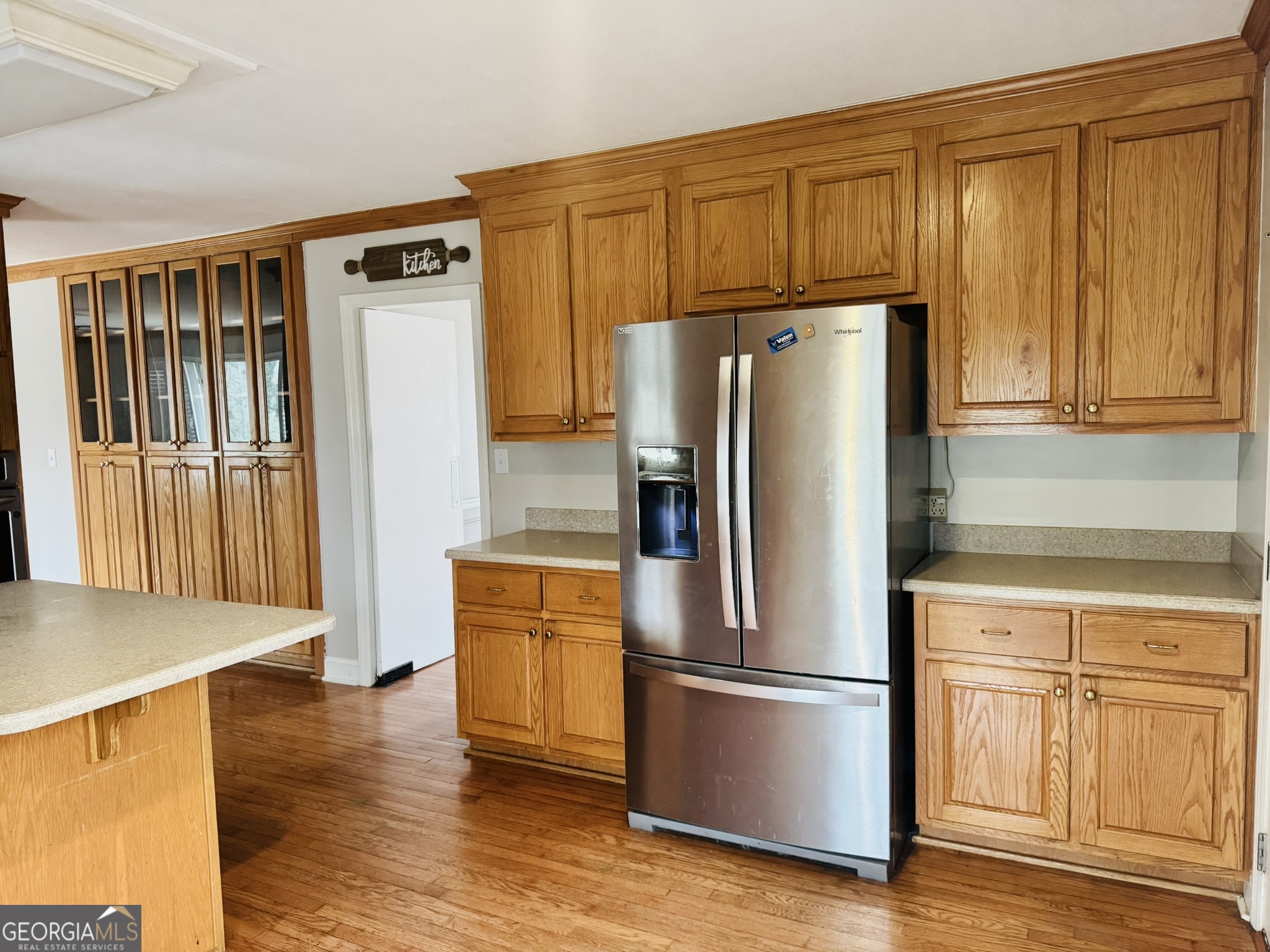 110 Pine Street Barnesville, GA 30204 - Photo 4 of 31 a kitchen with stainless steel appliances a refrigerator and wooden cabinets