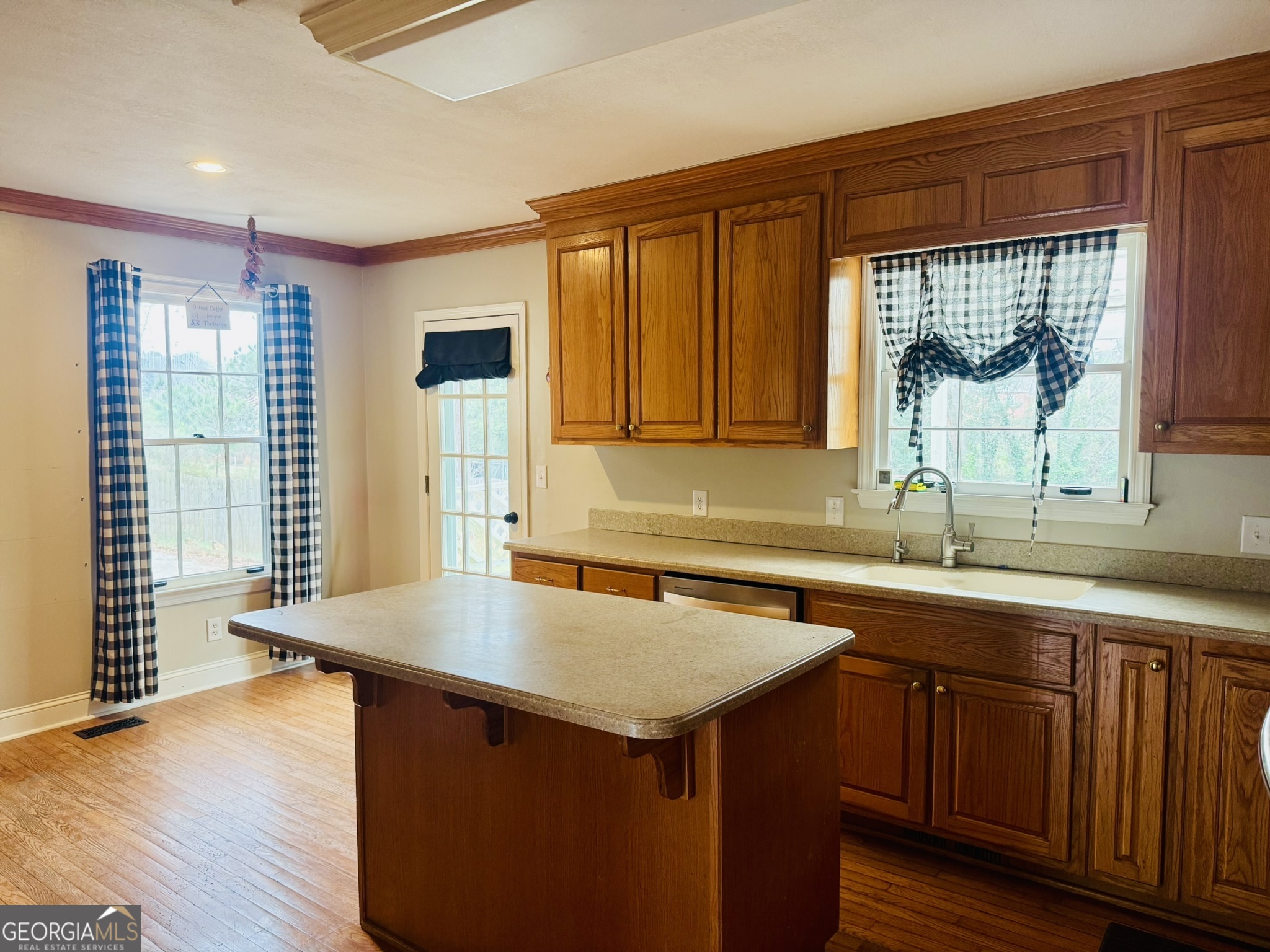 110 Pine Street Barnesville, GA 30204 - Photo 6 of 31 a kitchen with a sink and a window