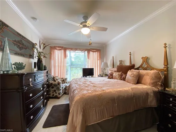 a bedroom with double bed and a window