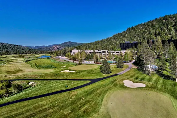 a view of a lake with a yard