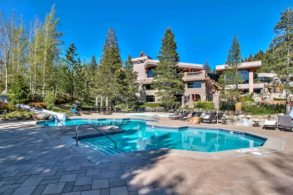 a view of swimming pool and outside seating area