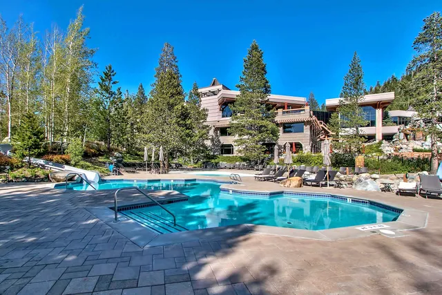 a view of swimming pool and outside seating area
